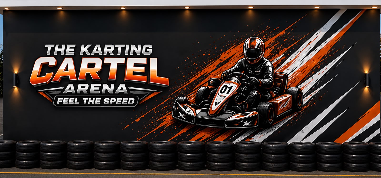 The Karting Cartel wall, a kart mural standing over a run of stacked racing tyres