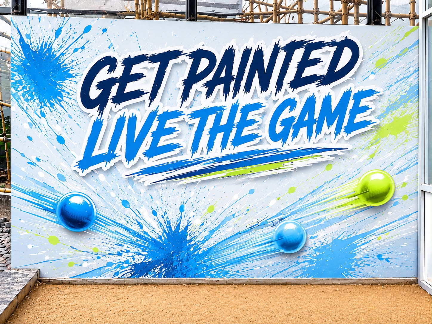 The "Get painted, live the game" paintball wall